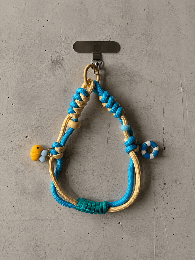 Turkusowo-żółty phone strap z kaczką i kołem ratunkowym